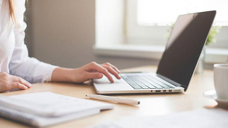 laptop and student typing